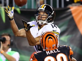 Pittsburgh wide receiver Derek Moye, left, catches a one-yard touchdown against Bengals cornerback Leon Hall at Paul Brown Stadium Monday in Cincinnati, Ohio.  (Photo by Andy Lyons/Getty Images)