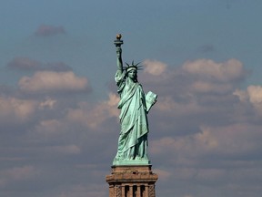 The Statue of Liberty, one of New York's premiere tourist attractions, is viewed from the Staten Island Ferry on September 30, 2013 in New York City. (Spencer Platt/Getty Images)