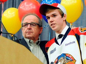 Erie Otters general manager Sherrie Bassin, left, introduces Connor McDavid in Erie, Pa. (THE CANADIAN PRESS/AP, Erie Times-News, Janet B. Kummerer)