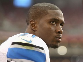 Lions running back Reggie Bush watches from the sidelines against the Arizona Cardinals. (Photo by Christian Petersen/Getty Images)