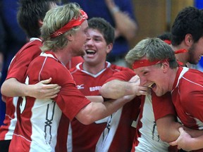 The Essex Red Raiders celebrate after winning the SWOSSAA volleyball championship against Walkerville. Players in front include Mitch Taveirne, from left, Cameron Branch and Jacob Taveirne. (DAN JANISSE/The Windsor Star)