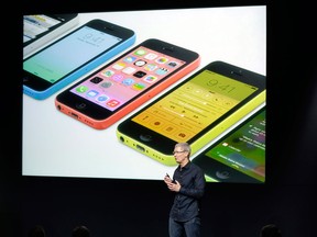 Tim Cook, CEO of Apple, speaks on stage during the introduction of the new iPhone 5c in Cupertino, Calif., Tuesday, Sept. 10, 2013. (AP Photo/Marcio Jose Sanchez)