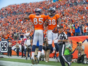 Wide receiver Demaryius Thomas #88 of the Denver Broncos celebrates a third quarter touchdown with Virgil Green #85 of the Philadelphia Eagles at Sports Authority Field Field at Mile High on September 29, 2013 in Denver, Colorado. (Photo by Dustin Bradford/Getty Images)