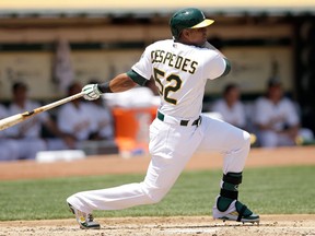 Oakland's Yoenis Cespedes hits a double against the St. Louis Cardinals. (Photo by Ezra Shaw/Getty Images)