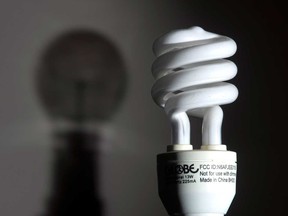 File photo of a shadow of an incandescent light bulb seen on a wall behind a Compact fluorescent light bulb (CFL). (Windsor Star files)