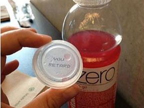 Coca-Cola has cancelled a Canadian promotion that paired randomly generated English and French words inside bottle caps after an Edmonton woman got one that said "You Retard."