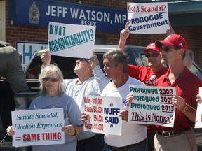 Union activists held a protest Thursday, Sept. 5, 2013, in front of MP Jeff Watson's constituency office in Essex, Ont. A number of speakers urged the government to get back to work. Approximately 100 people attended the event. Watson's office was closed and he was not present. (DAN JANISSE/The Windsor Star)