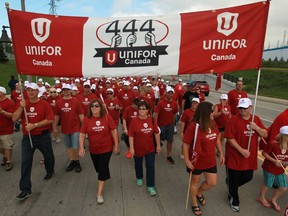 Hundreds of people participate in the annual Labour Day parade on Walker Road displaying the new Unifor name, Monday, Sept. 2, 2013.  (DAX MELMER/The Windsor Star)