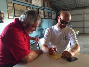 Essex County Warden Tom Bain and Mark Williams of the OHHA. (TwitPic: Nick Brancaccio/The Windsor Star)