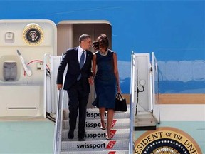 In this file photo, President Barack Obama, accompanied by first lady Michelle Obama, arrives at JFK International Airport in New York, Monday Sept. 23, 2013. (Windsor Star files)