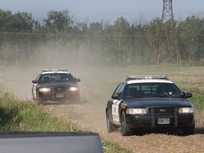 OPP leave the scene of a fatal ATV accident Tues. Sept. 10, 2013, on the South Middle Rd. just west of County Rd. 27. The accident occurred several hundred metres from the roadway. (DAN JANISSE/The Windsor Star)