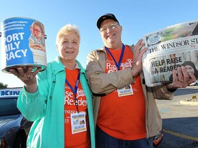 Emy McBride and Rick Tolmie sell papers during Raise-a-Reader day Thursday, Sept. 26, 2013, at the Tim Hortons on Jefferson Boulevard in Windsor, Ont. (DAN JANISSE/The Windsor Star)