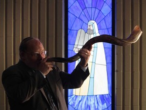 Rabbi Jeffrey Ableser displays a shofar at Congregation Beth El in Windsor, Ont., on the start of Rosh Hashanah on Tuesday, Sept. 3, 2013.  (JASON KRYK/The Windsor Star)