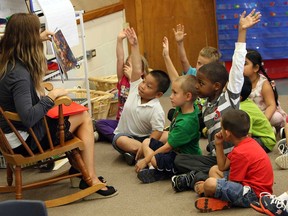 Nicola Dennis reads to her Grade 1 class at Marlborough Public School on September 3, 2013. The public school board has hired 23 more teachers due to an increase in the number of students this year.  (TYLER BROWNBRIDGE/The Windsor Star)