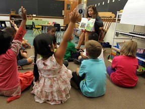 Nicola Dennis reads to her Grade 1 class at Marlborough Public School in Windsor on Tuesday, September 3, 2013. Students across the city were back in their classrooms to mark the start of the school year.           (TYLER BROWNBRIDGE/The Windsor Star)