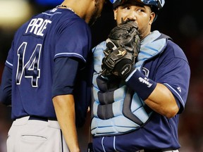 Tampa Bay's David Price, left, and catcher Jose Molina meet on the mound during the sixth inning of an American League wild-card tiebreaker baseball game against the Texas Rangers Monday. (AP Photo/Tony Gutierrez)