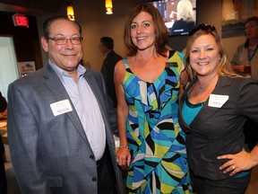 Scott Fischburg, left, Marianne Burke and Kelly McWhinnie enjoy the atmosphere during Windsor Essex Regional Chamber of Commerce After Business Event held at The Star's New Cafe at 300 Ouellette Avenue, Thursday September 12, 2013. (NICK BRANCACCIO/The Windsor Star)