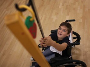 David Ceccucci, 9, from the Shoppers Home Health Care team, competes in the Windsor Wheelchair Relay Challenge in support of Spinal Cord Injury Ontario, at the WFCU Centre, Sunday, Sept. 29, 2013. (DAX MELMER/The Windsor Star)