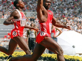 Canadian Ben Johnson, right, crosses the finish line to win the Olympic 100m final in a world record 9.79 seconds in Seou. (ROMEO GACAD/AFP/Getty Images)