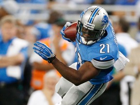 Detroit's Reggie Bush, right, tries to escape the tackle of Minnesota's Erin Henderson at Ford Field. (Photo by Gregory Shamus/Getty Images)