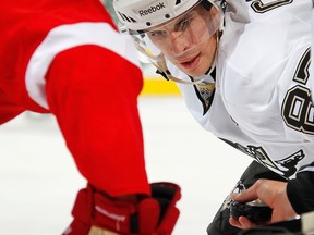 Pittsburgh's Sidney Crosby, right, gets ready for a faceoff in the third period against the Detroit Red Wings Wednesday at Joe Louis Arena. (Photo by Gregory Shamus/Getty Images)