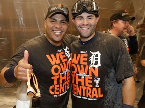 Detroit's Brayan Pena, left, and Alex Avila after the Tigers won the AL Central title with a 1-0 win over the Minnesota Twins Wednesday. (AP Photo/Jim Mone)