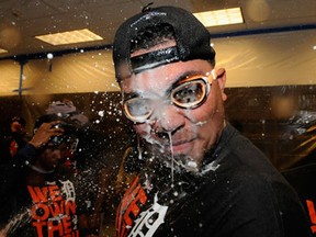 Detroit's Brayan Pena celebrates with champagne in the clubhouse after the Tigers defeated the Twins 1-0 at Target Field in Minneapolis. (Photo by Hannah Foslien/Getty Images)