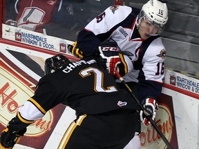 Windsor's Kerby Rychel, right, is checked by Sarnia's Joshua Chapman at the WFCU Centre Thursday. (TYLER BROWNBRIDGE/The Windsor Star)