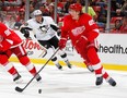 Detroit's Danny DeKeyser, right, looks up ice after getting around James Neal of the Penguins at Joe Louis Arena. (Photo by Gregory Shamus/Getty Images)