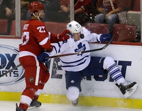 Detroit's Kyle Quincey, left, checks Toronto's Carter Ashton Friday in Detroit. (AP Photo/Carlos Osorio)