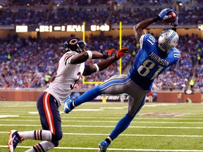 Detroit's Calvin Johnson, right, is covered by Chicago cornerback Charles Tillman on a two-yard touchdown pass from quarterback Matthew Stafford Sunday at Ford Field. (AP Photo/Jose Juarez)