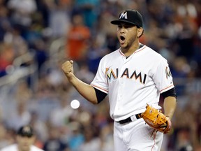 Miami's Henderson Alvarez, right, celebrates after striking out Detroit's Matt Tuiasosopo for the last out of the ninth inning in Miami. Alvarez pitched a no-hitter as the Marlins won 1-0. (AP Photo/Alan Diaz)