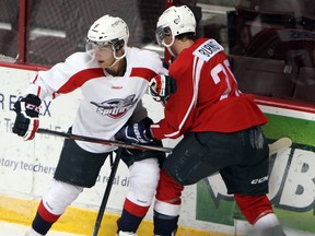 Spits defenceman Trevor Murphy, left, collides with rookie Andrews Burns during training camp at the WFCU Centre. (TYLER BROWNBRIDGE/The Windsor Star)