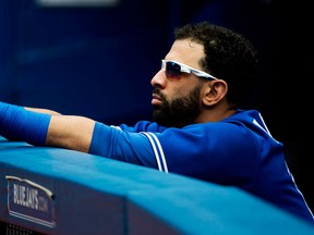 Toronto's Jose Bautista looks on from the dugout while playing against the Oakland Athletics. (THE CANADIAN PRESS/Nathan Denette)