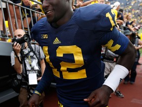 Michigan quarterback Devin Gardner leaves the field after a 59-9 win over the Central Michigan Chippewas at Michigan Stadium. (Photo by Gregory Shamus/Getty Images)
