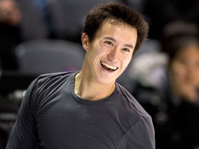 Canada's Patrick Chan smiles during a practice session at the World Figure Skating Championships in London. (THE CANADIAN PRESS/Paul Chiasson)