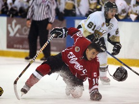 Leamington's Alex Segui, left, loses his helmet and glove following a collision against LaSalle at the Vollmer Centre. (NICK BRANCACCIO/The Windsor Star)