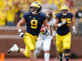 Michigan's Drew Dileo, left, runs for extra yards after a first quarter catch while playing the Central Michigan Chippewas at Michigan Stadium in Ann Arbor, (Photo by Gregory Shamus/Getty Images)