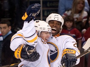 Buffalo's Nathan Gerbe, left, and Michael Grier celebrate after Gerbe scored against the Habs in Montreal. (Bryanna Bradley/Montreal Gazette)