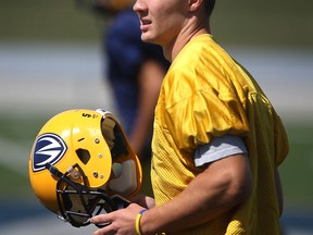 Lancer wide receiver Evan Pszczonak takes a break at practice at Alumni Field Friday. (DAX MELMER/The Windsor Star)