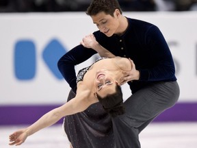 Canada's ice dance champions Tessa Virtue, left, and Scott Moir go through their routine during a practice session at the World Figure Skating Championships in London earlier this year. (THE CANADIAN PRESS/Paul Chiasson)