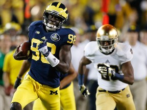 Michigan quarterback Devin Gardner runs for a first down against Notre Dame at Michigan Stadium Saturday. (Photo by Gregory Shamus/Getty Images)