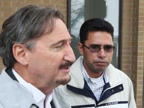 OCTOBER 26, 2012 -- Kuldeep Singh Dharni, right, accused of smuggling 100 kilos of cocaine worth an estimated street value of $10 million, was acquitted of all charges today. At left is his lawyer Patrick Ducharme outsiide the Superior Court of Justice in Windsor, Ontario.  (JASON KRYK/ The Windsor Star)