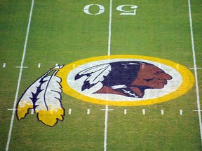 Washington Redskins logo on the field before he start of a preseason NFL football game in Landover, Md. (Associated Press files)