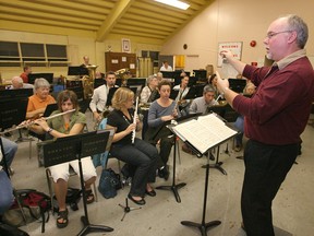 Conductor Ric Moor of the Greater Windsor Concert Band puts the musicians through their paces on Oct. 17, 2007. (Windsor Star files)