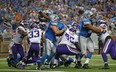 Joique Bell, centre, of the Detroit Lions scores on a two-yard run in the second quarter of the game against the Minnesota Vikings at Ford Field on September 8, 2013 in Detroit. (Leon Halip/Getty Images)