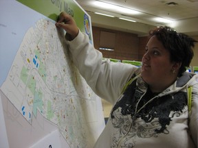 Windsor Resident Beth Beaugrand sticks a red dot on a city map to show which parks she uses. Beaugrand was among the first residents at the City of Windsor’s first public consultation to draft an updated parks master plan. The current plan dates back to 1989. Public consultations will be held in all wards through the autumn and winter. (Photo: Beatrice Fantoni/The Windsor Star)