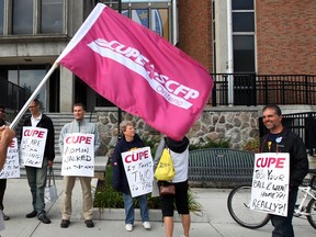 CUPE Local 1393 members picket outside the Chrysler Hall tower on the University of Windsor campus on Sept. 30, 2013. (Nick Brancaccio / The Windsor Star)