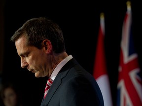 Former Ontario premier Dalton McGuinty and his finance minister, Dwight Duncan, bottom left, took the wood to teachers' and other public-sector unions, but new Premier Kathleen Wynne and Finance Minister Charles Sousa show no signs of continuing the fight, even though rising interest rates and slow growth in the provincial economy will put heavy pressure on the provincial budget. (Darren Calabrese/National Post)