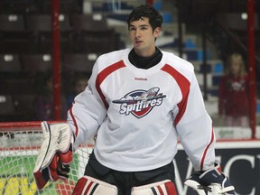 Spitfires goalie Jordan DeKort takes a break during training camp at the WFCU Centre in Windsor. Monday, DeKort stopped 13 of 14 shots in a 5-3 exhibition win over the Plymouth Whalers.  (DAN JANISSE/The Windsor Star)